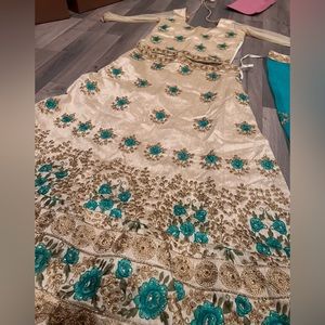 Beautiful cream with specks of blue lengha set.